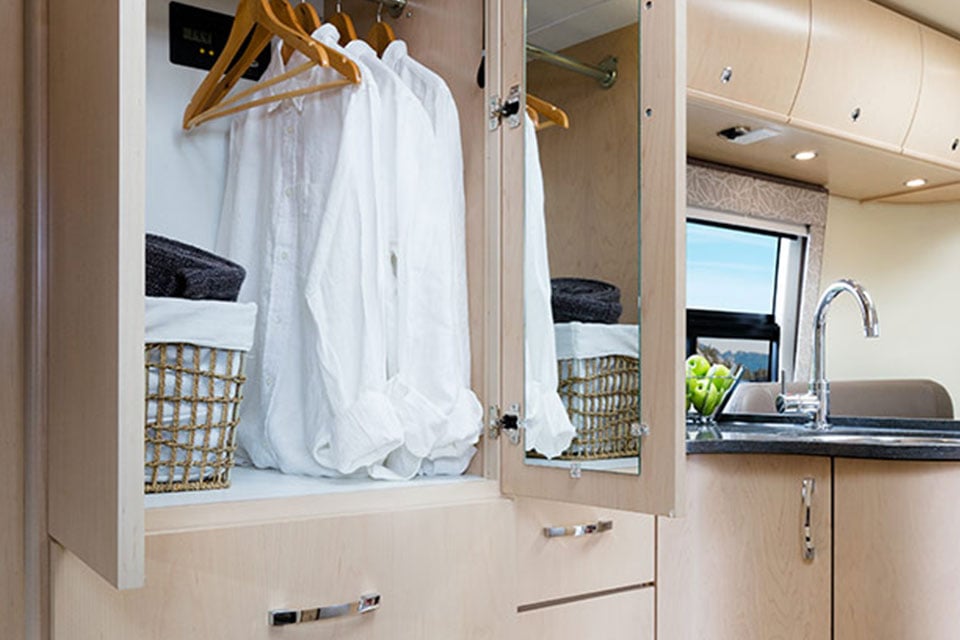 2016 Libero interior hanging storage. Shown in Sierra Maple cabinets & Mirage Décor.