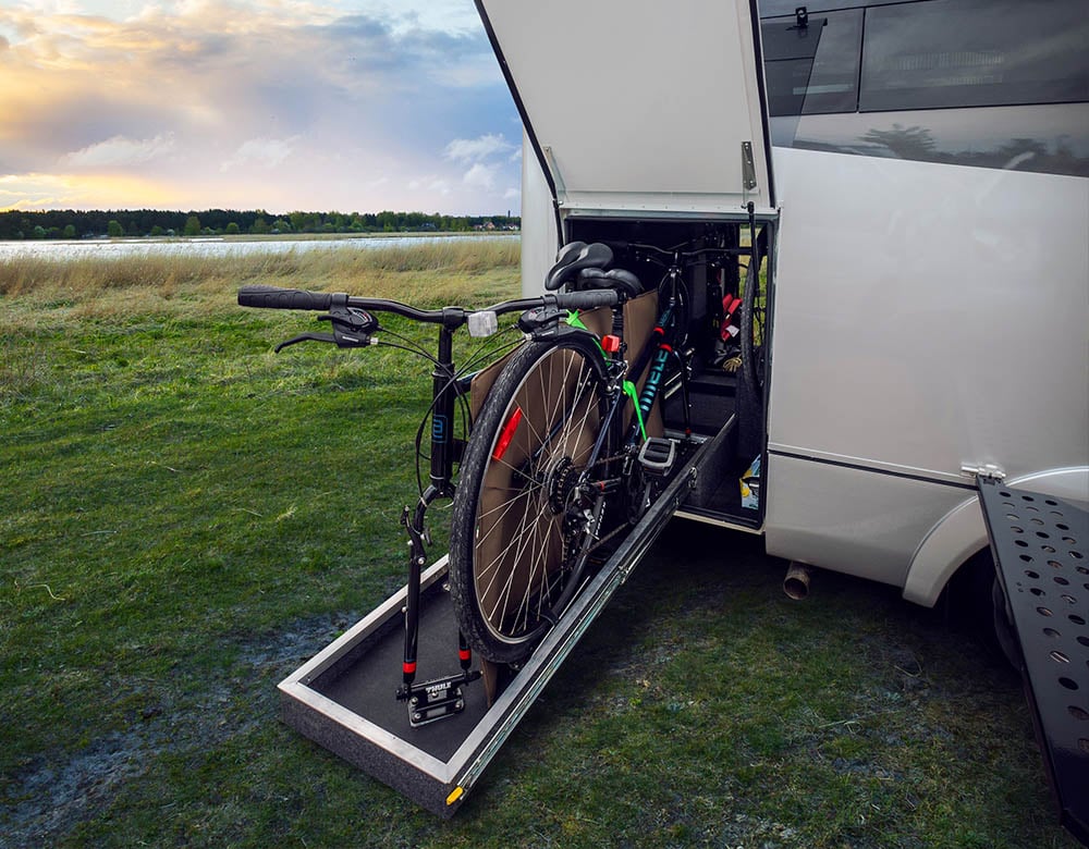 The garage storage is open, showing a bicycle